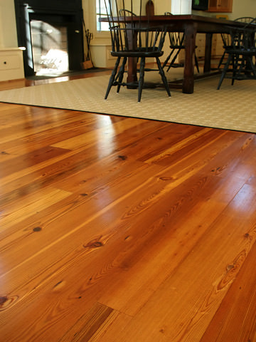 reclaimed heart pine flooring in a dining and living room