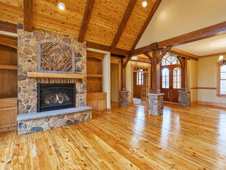 Rustic home with Heart Pine Flooring and Stone Fireplace