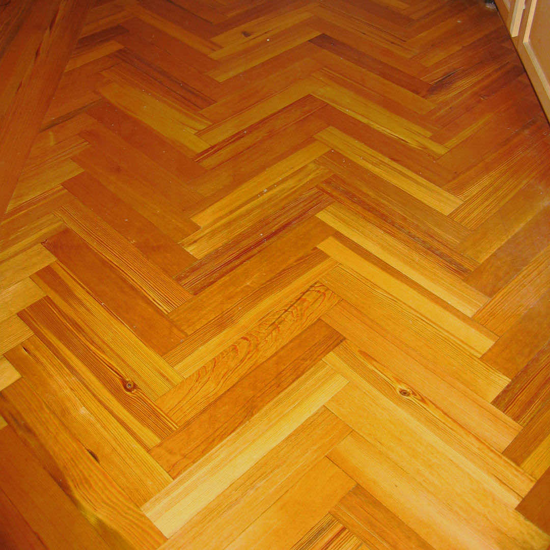 Heart pine wood set in a herringbone pattern.