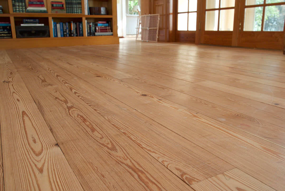 Rustic hardwood flooring in wide planks adds charm to a room.